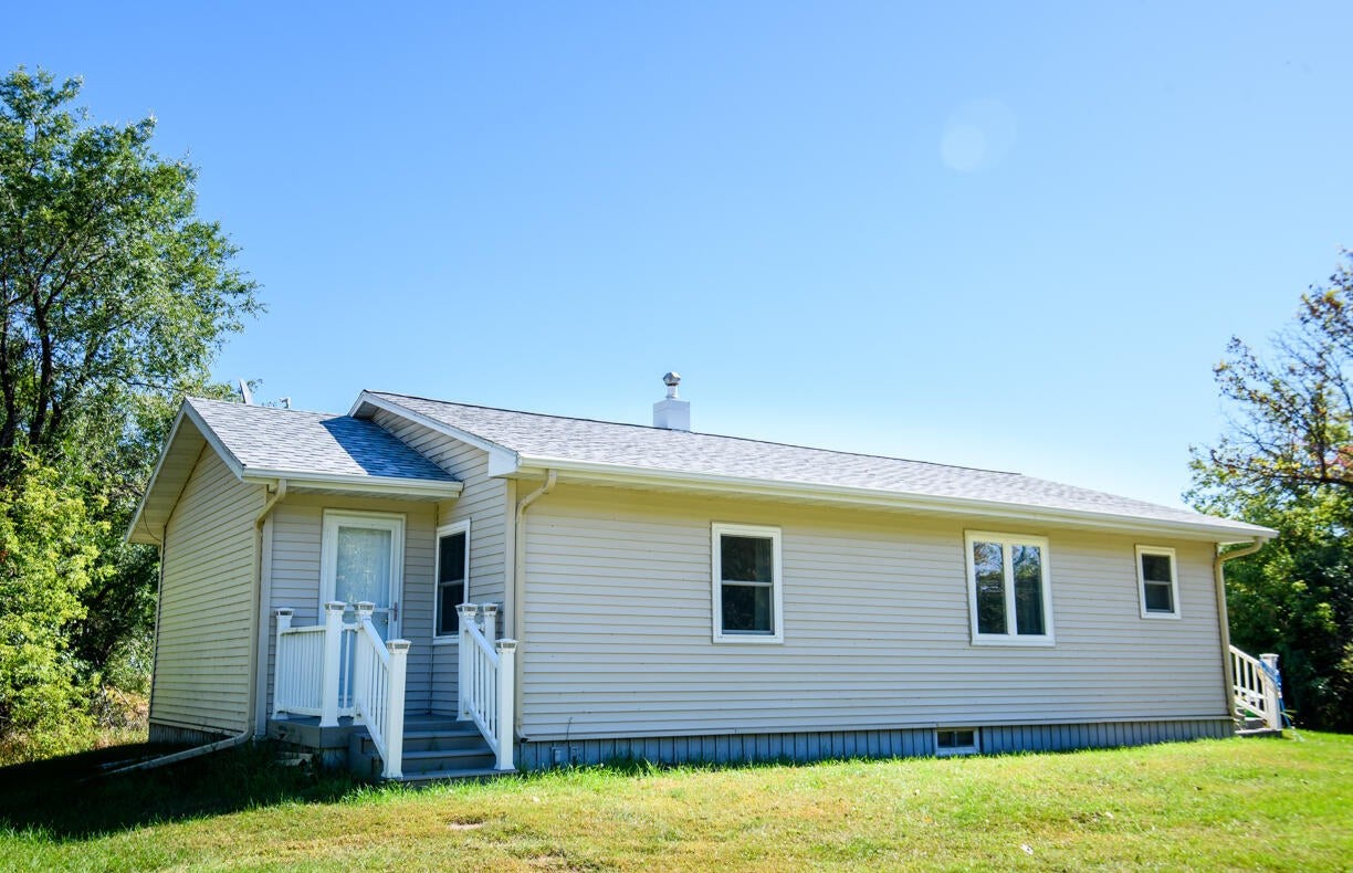 Front exterior of a country home near Thompson, ND