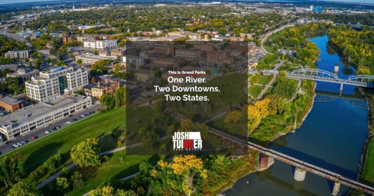Aerial view of two downtowns on either side of the river, with the words: One River. Two Downtowns. Two States.